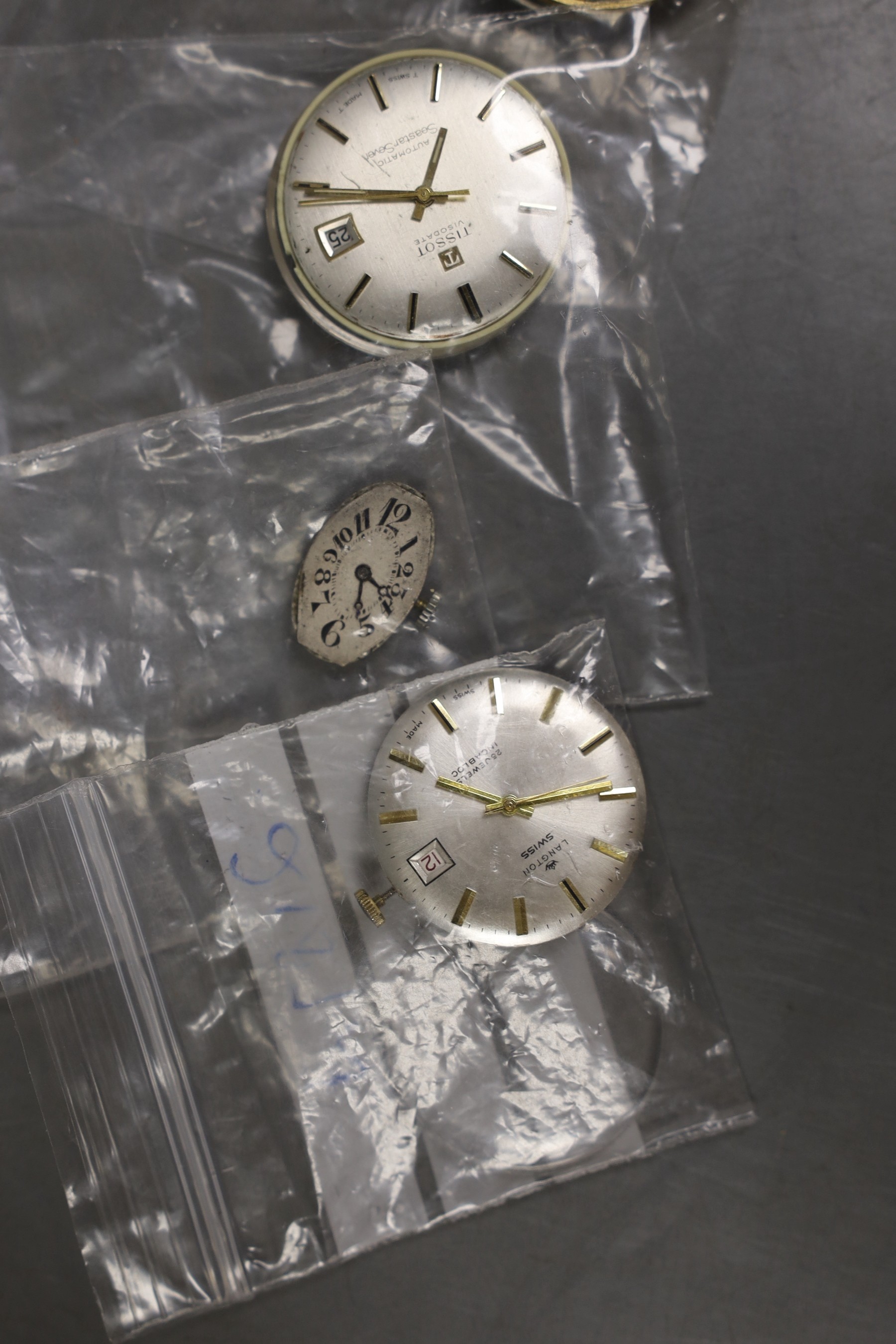 Six assorted wrist watch movements including Longines, Langton, Nivada, Tissot, Doxa and lady's oval dial.